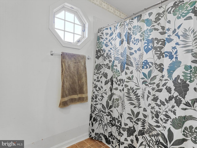 bathroom featuring tile patterned flooring and a shower with shower curtain