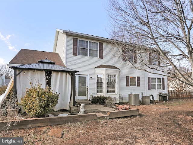 back of property with central air condition unit