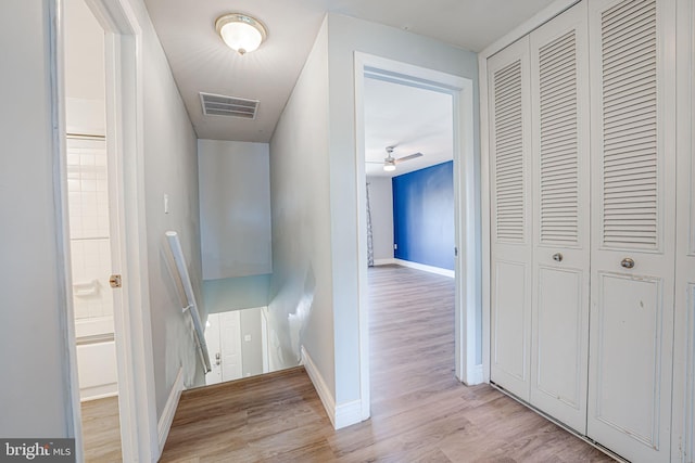 hall with light hardwood / wood-style floors