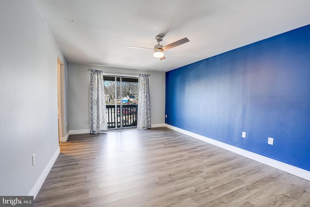 empty room featuring hardwood / wood-style flooring and ceiling fan