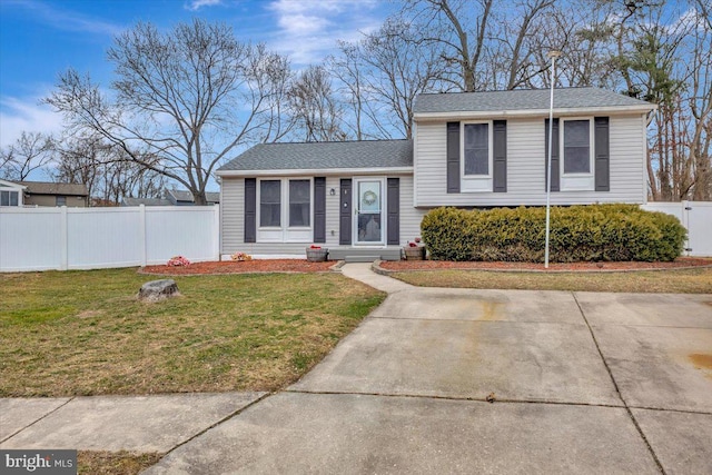 split level home featuring a front yard