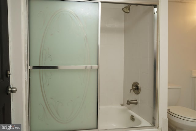 full bath with shower / bath combination with glass door and toilet