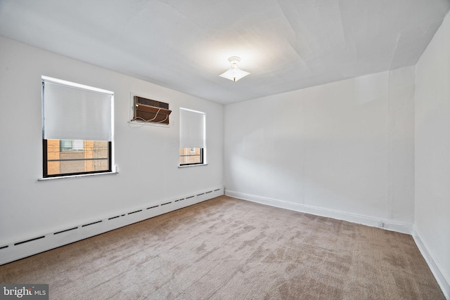 carpeted empty room featuring a baseboard radiator