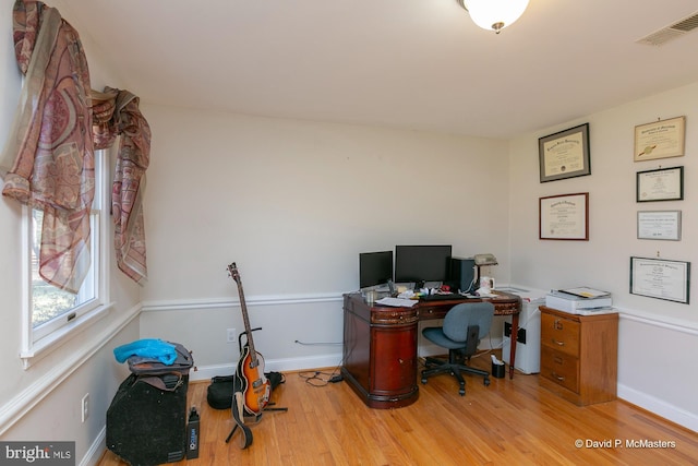 home office featuring light hardwood / wood-style flooring