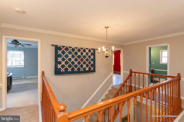 hall featuring light carpet, crown molding, a healthy amount of sunlight, and baseboard heating