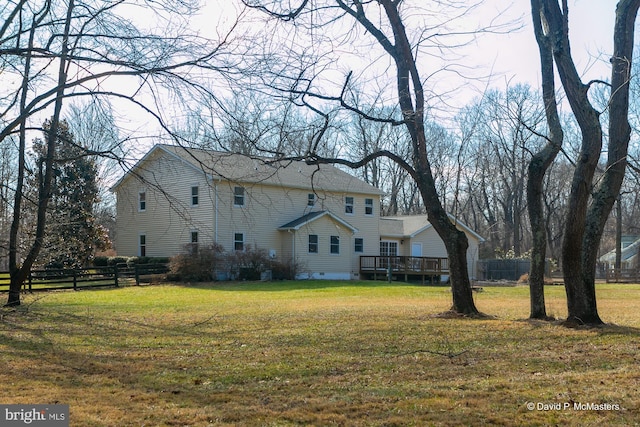 exterior space with a yard and a deck