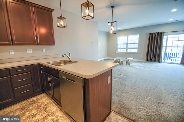 kitchen with sink, dishwasher, hanging light fixtures, light colored carpet, and kitchen peninsula