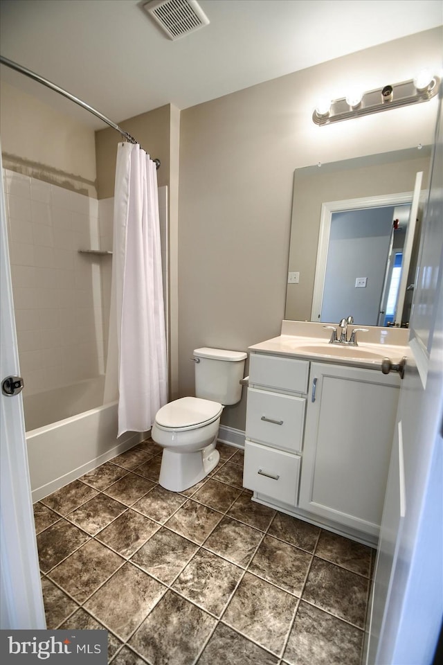 full bathroom featuring shower / bath combo, vanity, and toilet