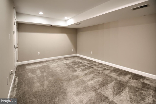 basement with dark carpet