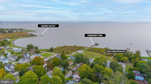 bird's eye view with a water view and a residential view