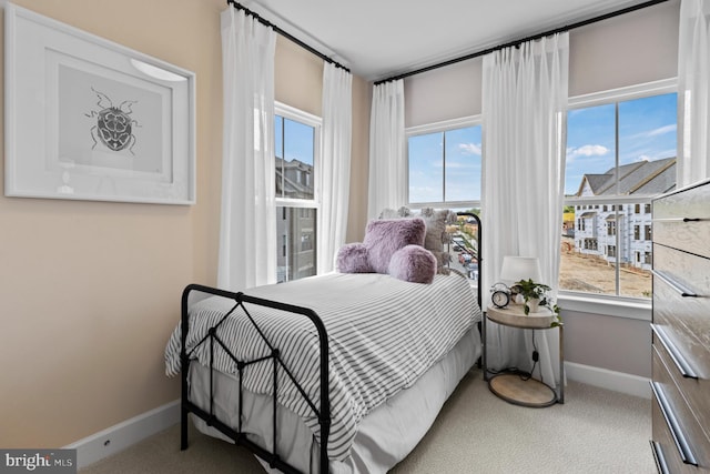 bedroom featuring light colored carpet