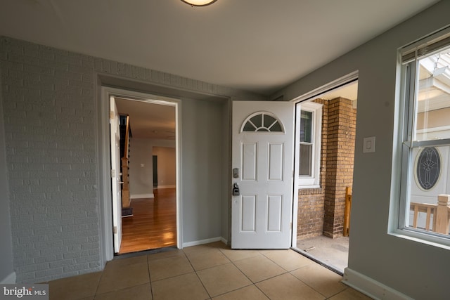 interior space featuring brick wall