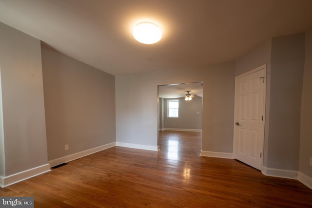 spare room featuring hardwood / wood-style flooring and ceiling fan