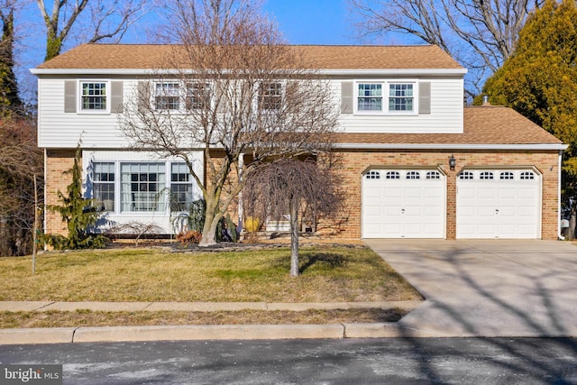 colonial home featuring brick siding, a shingled roof, a garage, driveway, and a front lawn