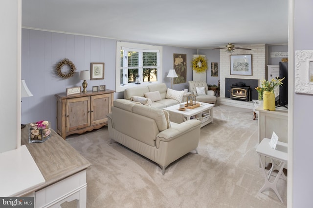 living room featuring light carpet and a ceiling fan