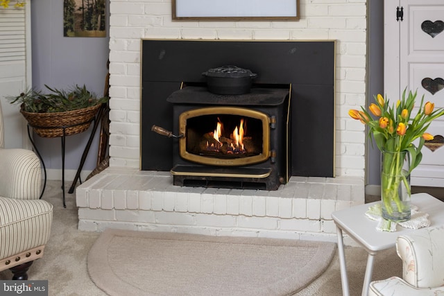 room details featuring carpet floors and a wood stove