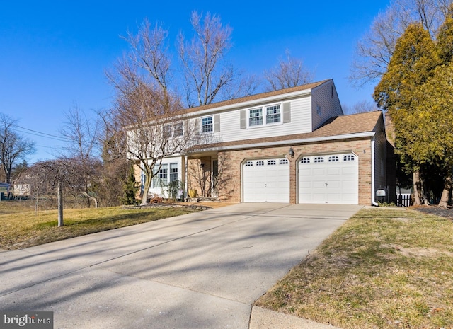 view of front facade with driveway, a front lawn, and brick siding