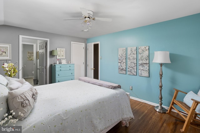 bedroom with ceiling fan, dark wood-type flooring, and baseboards