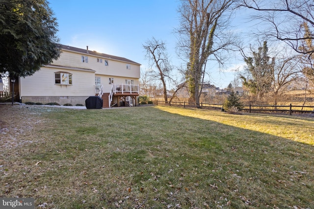 view of yard featuring stairway, fence private yard, and a wooden deck