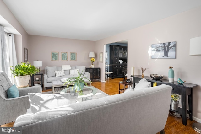 living room with wood finished floors and baseboards