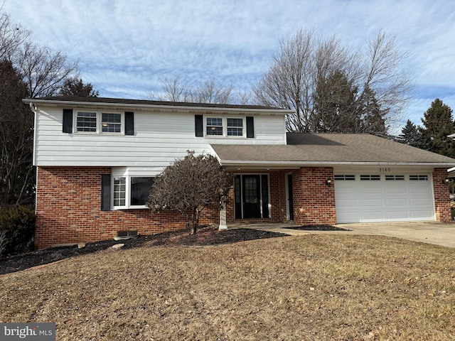 front of property featuring a garage and a front lawn