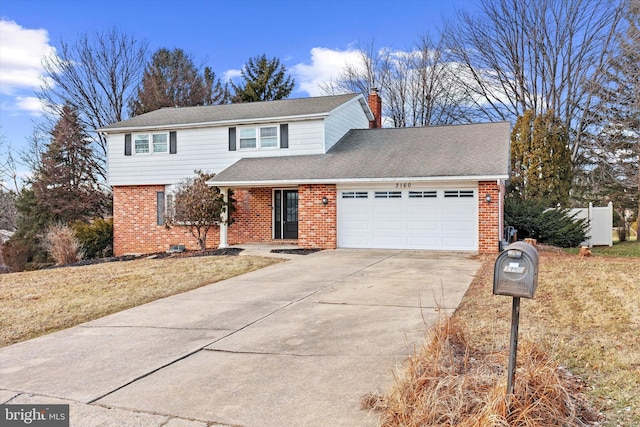 front of property featuring a garage and a front lawn