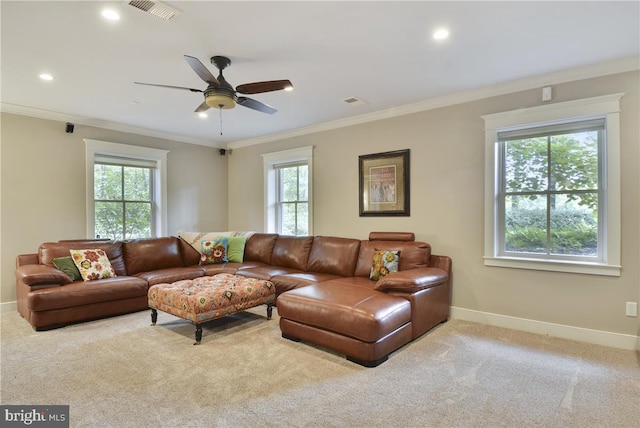 living room with crown molding, light colored carpet, and ceiling fan