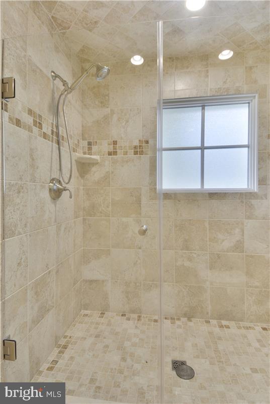 bathroom with an enclosed shower