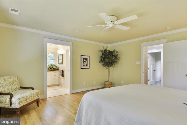 bedroom featuring connected bathroom, ornamental molding, ceiling fan, and light wood-type flooring