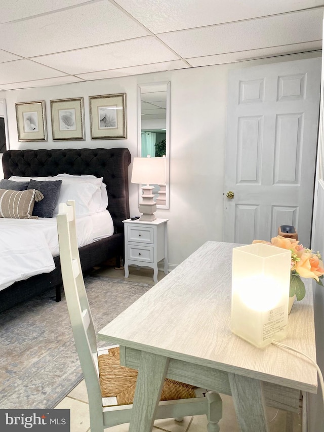 bedroom with a paneled ceiling