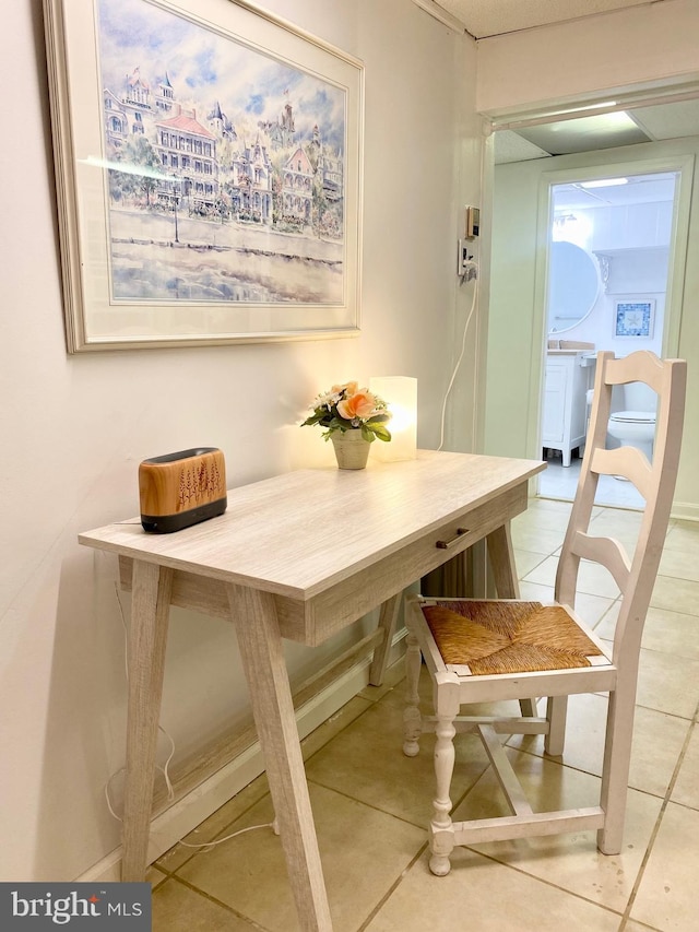 dining area featuring light tile patterned floors