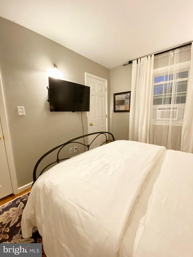 bedroom featuring baseboards