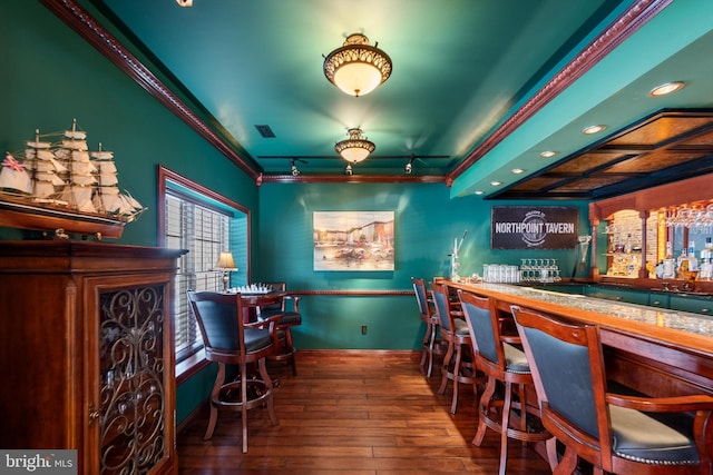 bar featuring wood-type flooring and ornamental molding