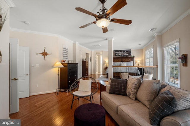 living room featuring crown molding, ceiling fan, and wood-type flooring