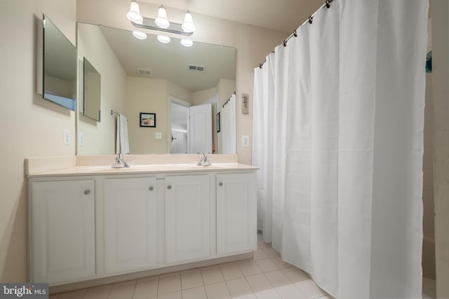 bathroom featuring tile patterned floors and vanity