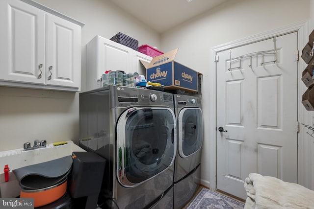 laundry room featuring cabinets and independent washer and dryer