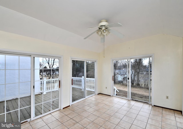 unfurnished sunroom with a water view, ceiling fan, and vaulted ceiling