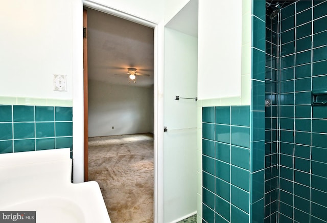 bathroom with tile walls and ceiling fan