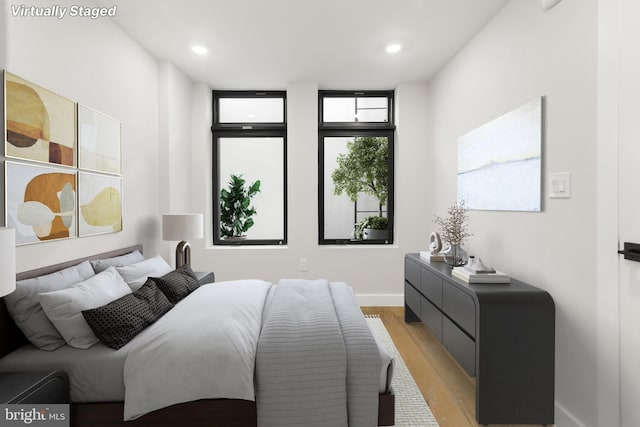 bedroom with light wood-type flooring