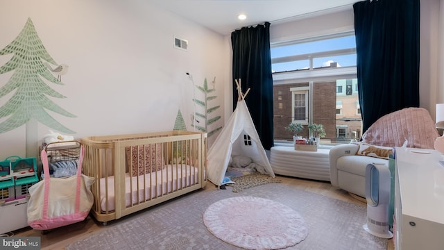 bedroom with hardwood / wood-style flooring