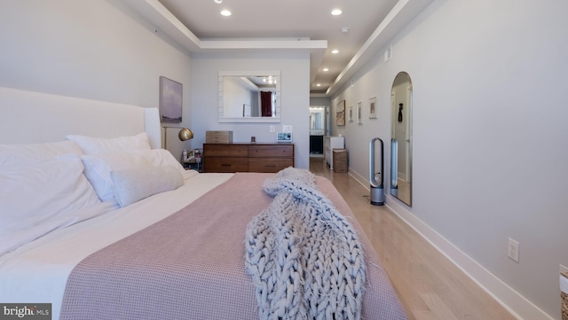 bedroom with light wood-type flooring