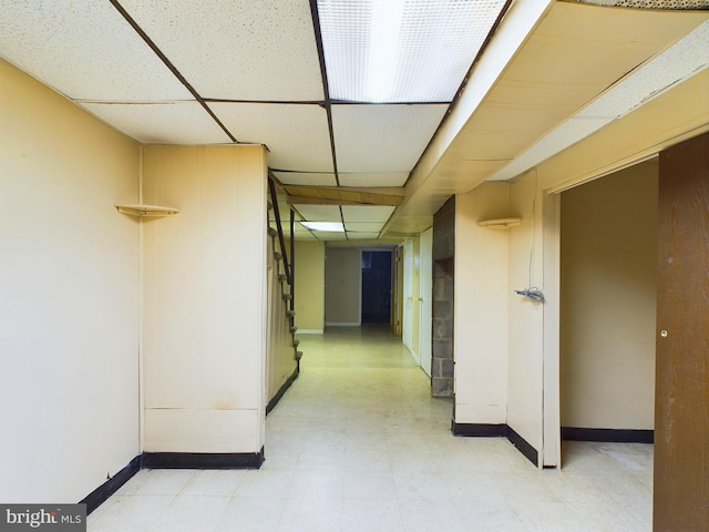 hallway featuring a paneled ceiling