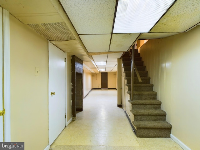 basement featuring a drop ceiling