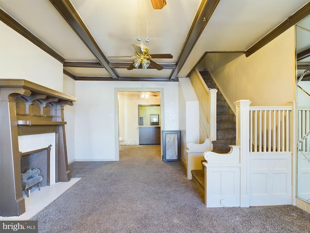 unfurnished living room with ceiling fan and light carpet