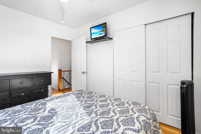 bedroom featuring light wood-style floors and a closet