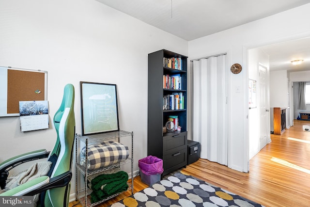 home office with wood finished floors