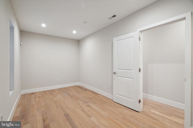 unfurnished room with light hardwood / wood-style floors