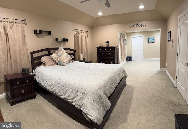 carpeted bedroom with vaulted ceiling and ceiling fan