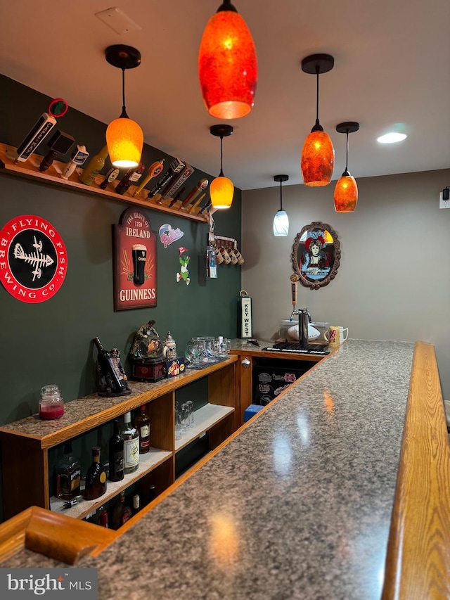 bar featuring decorative light fixtures