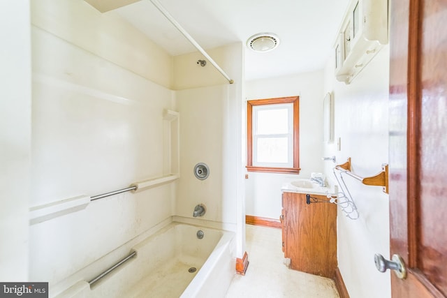 bathroom with shower / bathing tub combination, baseboards, and vanity
